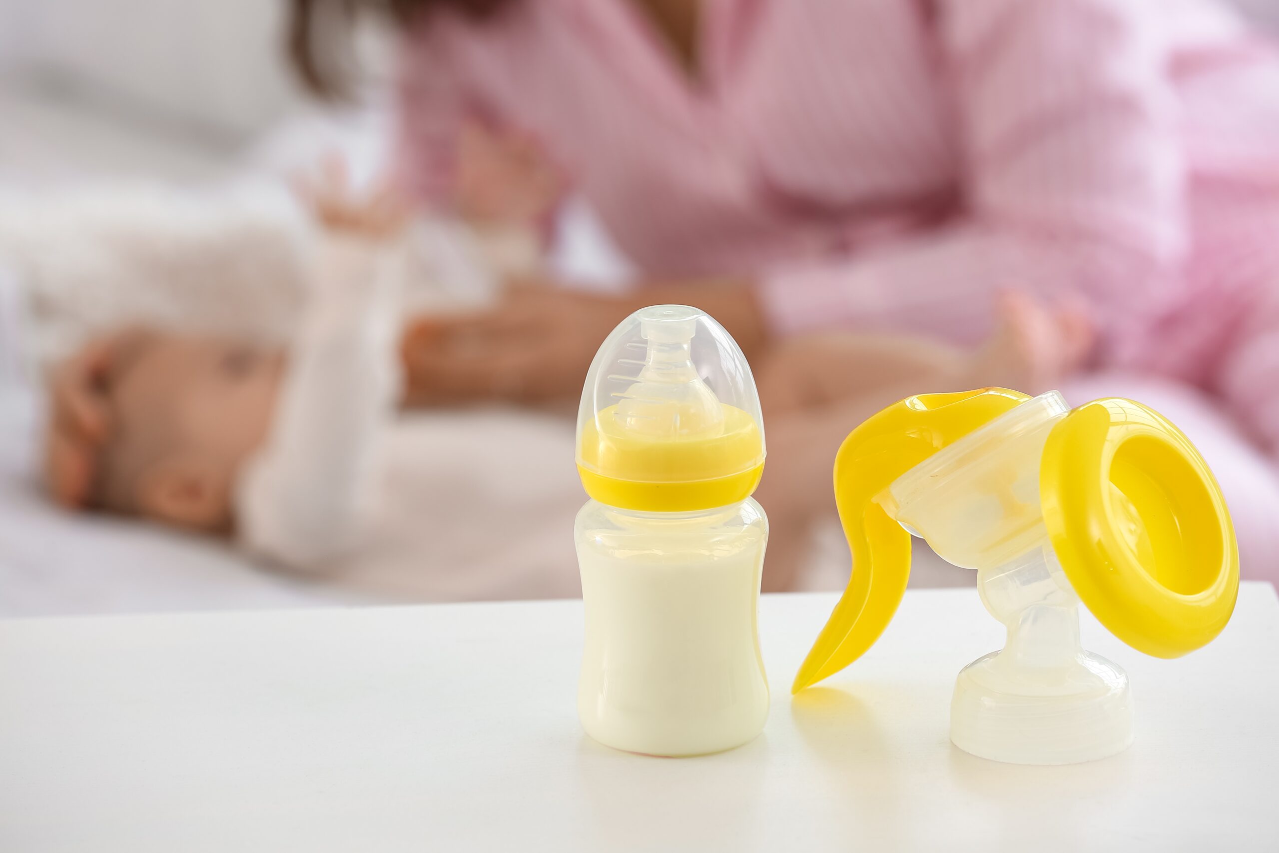Breast,Pump,With,Baby,Bottle,Of,Milk,On,Table,In Breast milk color meaning