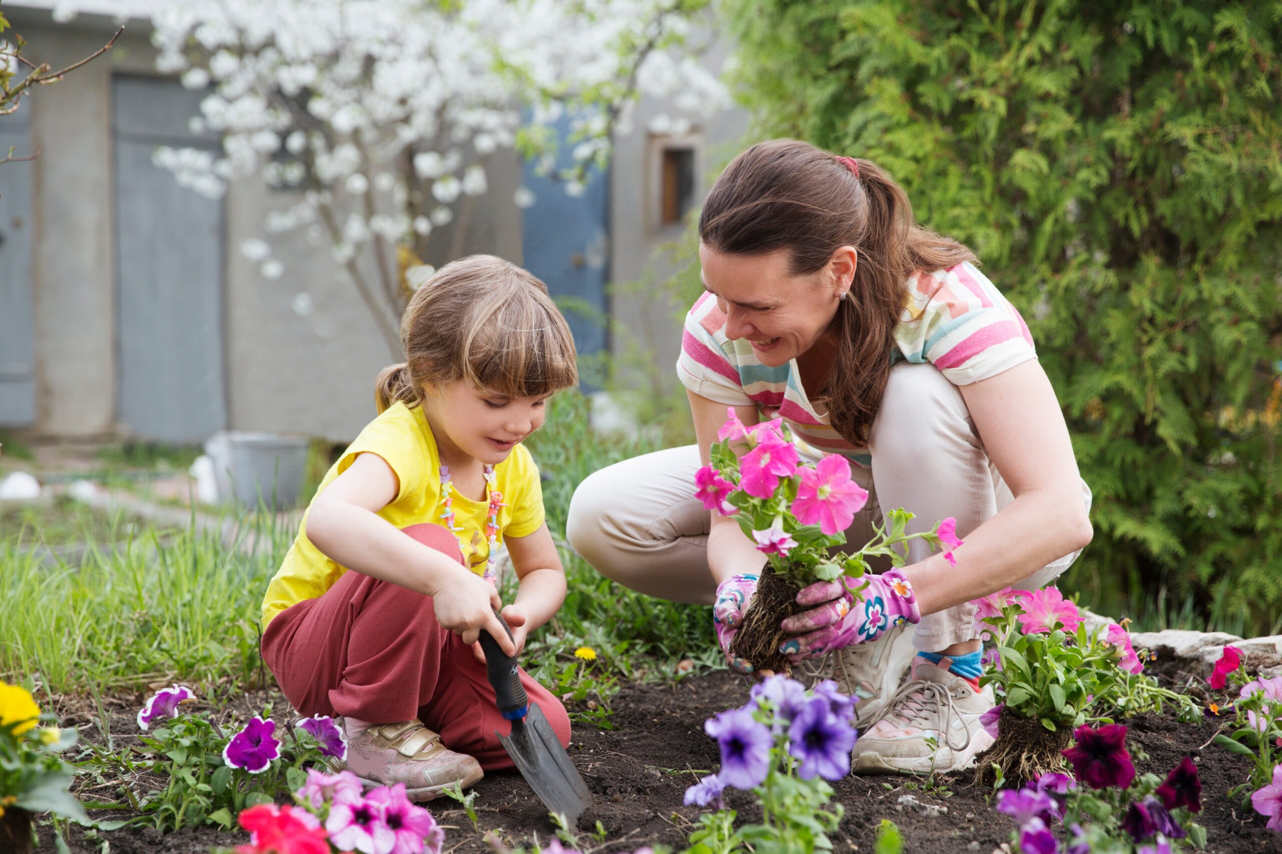 benefits of gardening with kids- mother gardening with child