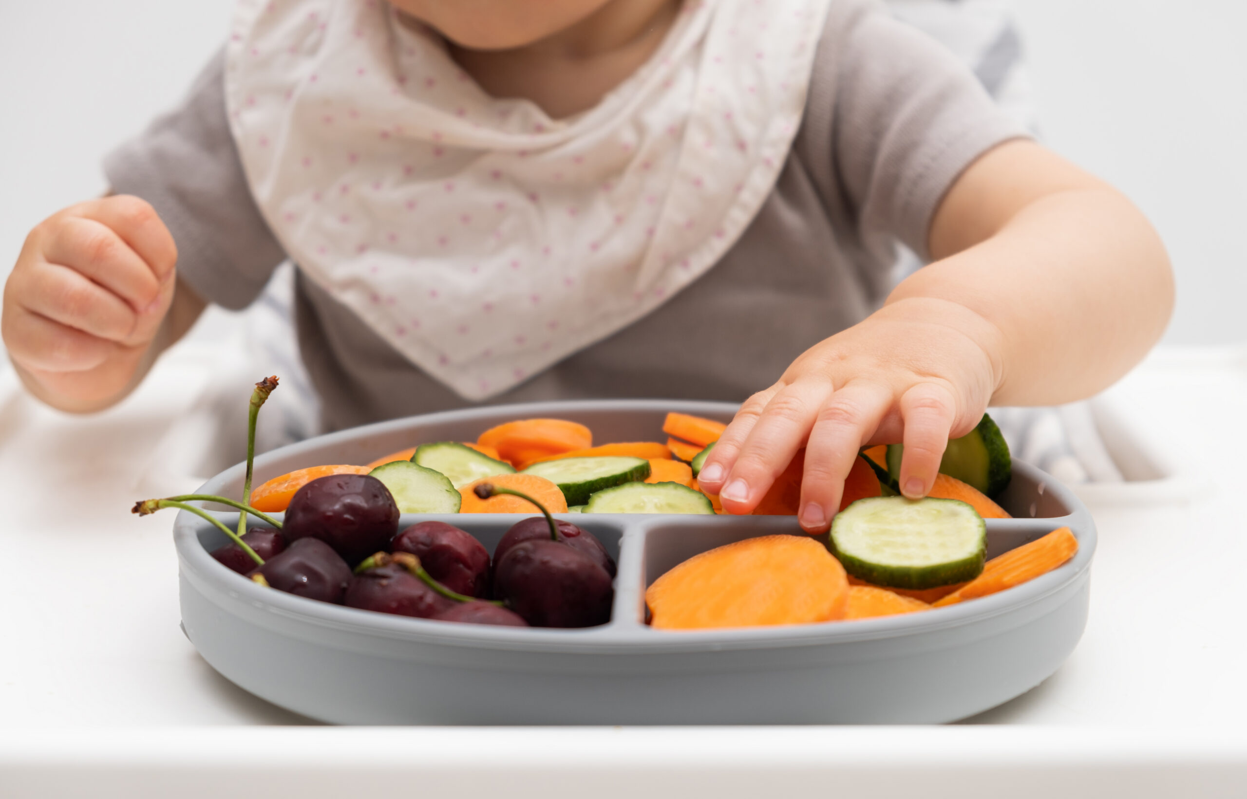 baby eating soft veggies